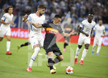 2021-09-30 - Olimpiu Morutan of Galatasaray, Luan Peres of Marseille (left) during the UEFA Europa League, Group E football match between Olympique de Marseille (OM) and Galatasaray SK on September 30, 2021 at Stade Velodrome in Marseille, France - OLYMPIQUE DE MARSEILLE (OM) VS GALATASARAY SK - UEFA EUROPA LEAGUE - SOCCER