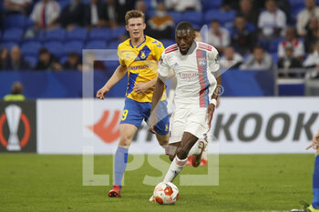 2021-09-30 - Karl TOKO EKAMBI of Lyon and Morten FRENDRUP of Brondby during the UEFA Europa League, Group A football match between Olympique Lyonnais and Brondby IF on September 30, 2021 at Groupama stadium in Decines-Charpieu near Lyon, France - OLYMPIQUE LYONNAIS VS BRONDBY IF - UEFA EUROPA LEAGUE - SOCCER