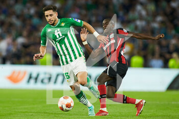 2021-10-21 - Alex Moreno of Real Betis and Moussa Diaby of Bayer 04 Leverkusen during the UEFA Europa League, Group G football match between Real Betis and Bayer 04 Leverkusen on October 21, 2021 at Benito Villamarin stadium in Sevilla, Spain - REAL BETIS VS BAYER 04 LEVERKUSEN - UEFA EUROPA LEAGUE - SOCCER