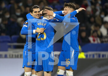 2021-12-09 - Scott Wright of Glasgow Rangers celebrates his goal with Ianis Hagi, Nathan Patterson during the UEFA Europa League, Group A football match between Olympique Lyonnais (Lyon) and Rangers FC on December 9, 2021 at Groupama stadium in Decines-Charpieu near Lyon, France - OLYMPIQUE LYONNAIS (LYON) VS RANGERS FC - UEFA EUROPA LEAGUE - SOCCER