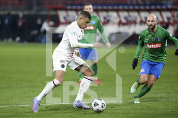 2021-12-19 - Kylian Mbappe of PSG, Valentin Calderara of Feignies-Aulnoye during the French Cup round of 32 football match between Entente Feignies-Aulnoye and Paris Saint Germain (PSG) on December 19, 2021 at Stade du Hainaut in Valenciennes, France - ENTENTE FEIGNIES-AULNOYE VS PARIS SAINT GERMAIN (PSG) - FRENCH CUP - SOCCER