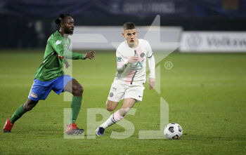 2021-12-19 - Ismael Gharbi of PSG, Allassane Ouattara of Feignies-Aulnoye (left) during the French Cup round of 32 football match between Entente Feignies-Aulnoye and Paris Saint Germain (PSG) on December 19, 2021 at Stade du Hainaut in Valenciennes, France - ENTENTE FEIGNIES-AULNOYE VS PARIS SAINT GERMAIN (PSG) - FRENCH CUP - SOCCER