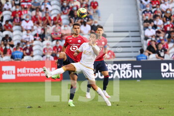 2021-08-14 - Duel Kluivert 21 Nice and Celik 2 LOSC during the French championship Ligue 1 football match between LOSC Lille and OGC Nice on August 14, 2021 at Pierre Mauroy stadium in Villeneuve-d'Ascq near Lille, France - Photo Laurent Sanson / LS Medianord / DPPI - LOSC LILLE VS OGC NICE - FRENCH LIGUE 1 - SOCCER
