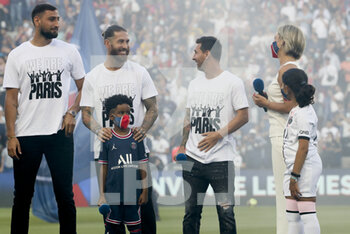 2021-08-14 - Goalkeeper of PSG Gianluigi Donnarumma, Sergio Ramos, Lionel Messi, presenter Anne-Laure Bonnet during the new recruits of PSG presentation ahead of the French championship Ligue 1 football match between Paris Saint-Germain and RC Strasbourg on August 14, 2021 at Parc des Princes stadium in Paris, France - Photo Jean Catuffe / DPPI - PARIS SAINT-GERMAIN VS RC STRASBOURG - FRENCH LIGUE 1 - SOCCER