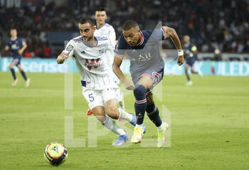 2021-08-14 - Kylian Mbappe of PSG, Lucas Perrin of Strasbourg (left) during the French championship Ligue 1 football match between Paris Saint-Germain and RC Strasbourg on August 14, 2021 at Parc des Princes stadium in Paris, France - Photo Jean Catuffe / DPPI - PARIS SAINT-GERMAIN VS RC STRASBOURG - FRENCH LIGUE 1 - SOCCER