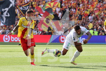 2021-08-15 - Jonathan Clauss 11 Lens and Denis Bouanga 20 Saint-Etienne during the French championship Ligue 1 football match between RC Lens and AS Saint-Etienne on August 15, 2021 at Bollaert-Delelis stadium in Lens, France - Photo Laurent Sanson / LS Medianord / DPPI - RC LENS VS AS SAINT-ETIENNE - FRENCH LIGUE 1 - SOCCER