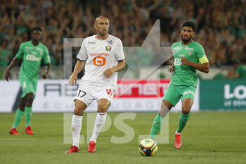 2021-08-21 - Burak YILMAZ of Lille and Mahdi CAMARA of Saint Etienne during the French championship Ligue 1 football match between AS Saint-Etienne and LOSC Lille on August 21, 2021 at Geoffroy-Guichard stadium in Saint-Etienne, France - Photo Romain Biard / Isports / DPPI - AS SAINT-ETIENNE (ASSE) VS LILLE OSC (LOSC) - FRENCH LIGUE 1 - SOCCER