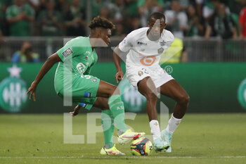 2021-08-21 - Mathys SABAN of Saint Etienne and Tiago EMBALO DJALO of Lille during the French championship Ligue 1 football match between AS Saint-Etienne and LOSC Lille on August 21, 2021 at Geoffroy-Guichard stadium in Saint-Etienne, France - Photo Romain Biard / Isports / DPPI - AS SAINT-ETIENNE (ASSE) VS LILLE OSC (LOSC) - FRENCH LIGUE 1 - SOCCER
