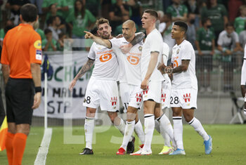 2021-08-21 - Burak Yilmaz of Lille celebrates his goal with Xeka, Sven Botman and Reinildo Mandava during the French championship Ligue 1 football match between AS Saint-Etienne (ASSE) and Lille OSC (LOSC) on August 21, 2021 at Stade Geoffroy-Guichard in Saint-Etienne, France - Photo Jean Catuffe / DPPI - AS SAINT-ETIENNE (ASSE) VS LILLE OSC (LOSC) - FRENCH LIGUE 1 - SOCCER