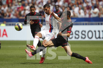 2021-08-22 - Houssem AOUAR of Lyon and Florent OGIER of Clermont during the French championship Ligue 1 football match between Olympique Lyonnais and Clermont Foot 63 on August 22, 2021 at Groupama stadium in Decines-Charpieu near Lyon, France - Photo Romain Biard / Isports / DPPI - OLYMPIQUE LYONNAIS VS CLERMONT FOOT 63 - FRENCH LIGUE 1 - SOCCER