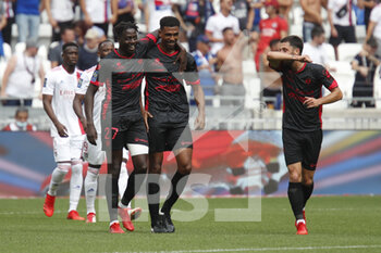 2021-08-22 - Mohamed BAYO of Clermont and Cedric HOUNTONDJI of Clermont and Jason BERTHOMIER of Clermont during the French championship Ligue 1 football match between Olympique Lyonnais and Clermont Foot 63 on August 22, 2021 at Groupama stadium in Decines-Charpieu near Lyon, France - Photo Romain Biard / Isports / DPPI - OLYMPIQUE LYONNAIS VS CLERMONT FOOT 63 - FRENCH LIGUE 1 - SOCCER