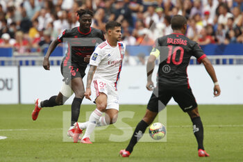 2021-08-22 - Bruno GUIMARAES of Lyon and Mohamed BAYO of Clermont during the French championship Ligue 1 football match between Olympique Lyonnais and Clermont Foot 63 on August 22, 2021 at Groupama stadium in Decines-Charpieu near Lyon, France - Photo Romain Biard / Isports / DPPI - OLYMPIQUE LYONNAIS VS CLERMONT FOOT 63 - FRENCH LIGUE 1 - SOCCER