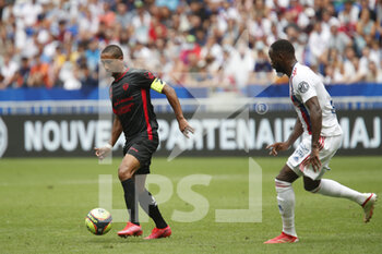 2021-08-22 - Jonathan IGLESIAS of Clermont and Moussa DEMBELE of Lyon during the French championship Ligue 1 football match between Olympique Lyonnais and Clermont Foot 63 on August 22, 2021 at Groupama stadium in Decines-Charpieu near Lyon, France - Photo Romain Biard / Isports / DPPI - OLYMPIQUE LYONNAIS VS CLERMONT FOOT 63 - FRENCH LIGUE 1 - SOCCER