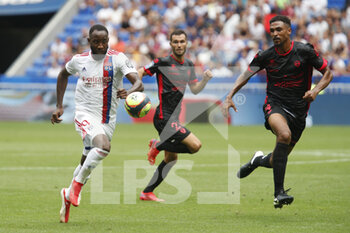 2021-08-22 - Moussa DEMBELE of Lyon and Cedric HOUNTONDJI of Clermont during the French championship Ligue 1 football match between Olympique Lyonnais and Clermont Foot 63 on August 22, 2021 at Groupama stadium in Decines-Charpieu near Lyon, France - Photo Romain Biard / Isports / DPPI - OLYMPIQUE LYONNAIS VS CLERMONT FOOT 63 - FRENCH LIGUE 1 - SOCCER