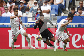 2021-08-22 - Jim ALLEVINAH of Clermont and Lucas PAQUETA of Lyon and Leo DUBOIS of Lyon during the French championship Ligue 1 football match between Olympique Lyonnais and Clermont Foot 63 on August 22, 2021 at Groupama stadium in Decines-Charpieu near Lyon, France - Photo Romain Biard / Isports / DPPI - OLYMPIQUE LYONNAIS VS CLERMONT FOOT 63 - FRENCH LIGUE 1 - SOCCER