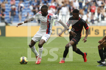 2021-08-22 - Karl TOKO EKAMBI of Lyon and Salis ABDUL SAMED of Clermont during the French championship Ligue 1 football match between Olympique Lyonnais and Clermont Foot 63 on August 22, 2021 at Groupama stadium in Decines-Charpieu near Lyon, France - Photo Romain Biard / Isports / DPPI - OLYMPIQUE LYONNAIS VS CLERMONT FOOT 63 - FRENCH LIGUE 1 - SOCCER