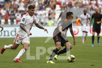 2021-08-22 - Saif KHAOUI of Clermont and Bruno GUIMARAES of Lyon during the French championship Ligue 1 football match between Olympique Lyonnais and Clermont Foot 63 on August 22, 2021 at Groupama stadium in Decines-Charpieu near Lyon, France - Photo Romain Biard / Isports / DPPI - OLYMPIQUE LYONNAIS VS CLERMONT FOOT 63 - FRENCH LIGUE 1 - SOCCER