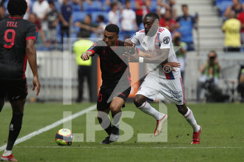 2021-08-22 - Akim ZEDADKA of Clermont and Karl TOKO EKAMBI of Lyon during the French championship Ligue 1 football match between Olympique Lyonnais and Clermont Foot 63 on August 22, 2021 at Groupama stadium in Decines-Charpieu near Lyon, France - Photo Romain Biard / Isports / DPPI - OLYMPIQUE LYONNAIS VS CLERMONT FOOT 63 - FRENCH LIGUE 1 - SOCCER