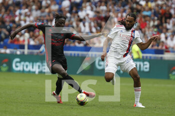 2021-08-22 - Mohamed BAYO of Clermont and Jason DENAYER of Lyon during the French championship Ligue 1 football match between Olympique Lyonnais and Clermont Foot 63 on August 22, 2021 at Groupama stadium in Decines-Charpieu near Lyon, France - Photo Romain Biard / Isports / DPPI - OLYMPIQUE LYONNAIS VS CLERMONT FOOT 63 - FRENCH LIGUE 1 - SOCCER