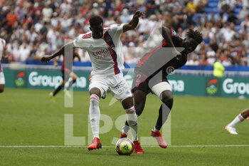 2021-08-22 - Sinaly DIOMANDE of Lyon and Mohamed BAYO of Clermont during the French championship Ligue 1 football match between Olympique Lyonnais and Clermont Foot 63 on August 22, 2021 at Groupama stadium in Decines-Charpieu near Lyon, France - Photo Romain Biard / Isports / DPPI - OLYMPIQUE LYONNAIS VS CLERMONT FOOT 63 - FRENCH LIGUE 1 - SOCCER