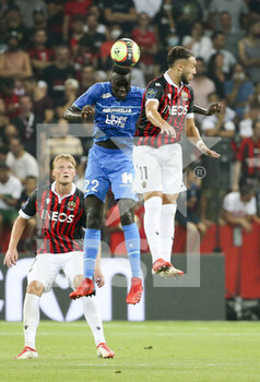 2021-08-22 - Pape Gueye of Marseille, Amine Gouiri of Nice during the French championship Ligue 1 football match between OGC Nice (OGCN) and Olympique de Marseille (OM) on August 22, 2021 at Allianz Riviera stadium in Nice, France - Photo Jean Catuffe / DPPI - OGC NICE (OGCN) VS OLYMPIQUE DE MARSEILLE (OM) - FRENCH LIGUE 1 - SOCCER