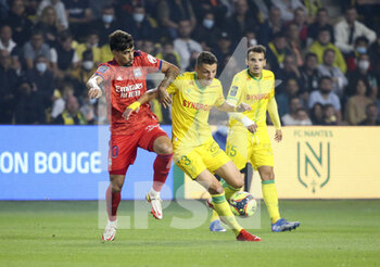 2021-08-27 - Andrei Girotto of Nantes, Lucas Paqueta of Lyon (left) during the French championship Ligue 1 football match between FC Nantes and Olympique Lyonnais (OL) on August 27, 2021 at Stade de La Beaujoire - Louis Fonteneau in Nantes, France - Photo Jean Catuffe / DPPI - FC NANTES VS OLYMPIQUE LYONNAIS - FRENCH LIGUE 1 - SOCCER