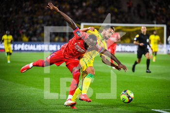 2021-08-27 - Moussa DEMBELE of Lyon and Fabio of Nantes during the French championship Ligue 1 football match between FC Nantes and Olympique Lyonnais on August 27, 2021 at La Beaujoire - Louis Fonteneau stadium in Nantes, France - Photo Matthieu Mirville / DPPI - FC NANTES VS OLYMPIQUE LYONNAIS - FRENCH LIGUE 1 - SOCCER