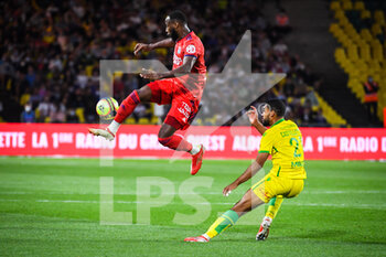 2021-08-27 - Moussa DEMBELE of Lyon and Jean-Charles CASTELLETTO of Nantes during the French championship Ligue 1 football match between FC Nantes and Olympique Lyonnais on August 27, 2021 at La Beaujoire - Louis Fonteneau stadium in Nantes, France - Photo Matthieu Mirville / DPPI - FC NANTES VS OLYMPIQUE LYONNAIS - FRENCH LIGUE 1 - SOCCER