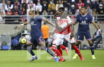 2021-08-29 - Neymar Jr of PSG, Moreto Cassama of Reims, Kylian Mbappe of PSG during the French championship Ligue 1 football match between Stade de Reims and Paris Saint-Germain on August 29, 2021 at Auguste Delaune stadium in Reims, France - Photo Jean Catuffe / DPPI - STADE DE REIMS VS PARIS SAINT-GERMAIN - FRENCH LIGUE 1 - SOCCER