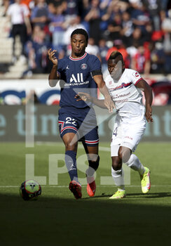 2021-09-11 - Abdou Diallo of PSG, Jodel Dossou of Clermont during the French championship Ligue 1 football match between Paris Saint-Germain (PSG) and Clermont Foot 63 on September 11, 2021 at Parc des Princes stadium in Paris, France - PARIS SAINT-GERMAIN VS CLERMONT FOOT 63 - FRENCH LIGUE 1 - SOCCER