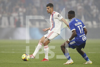 2021-09-12 - Bruno GUIMARAES of Lyon and Jean Ricner BELLEGARDE of Strasbourg during the French championship Ligue 1 football match between Olympique lyonnais and Racing Club de Strasbourg Alsace on September 12, 2021 at Groupama Stadium in Décines-Charpieu, near Lyon, France - OLYMPIQUE LYONNAIS VS RACING CLUB DE STRASBOURG ALSACE - FRENCH LIGUE 1 - SOCCER