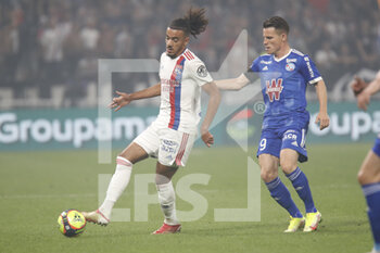 2021-09-12 - Malo GUSTO of Lyon and Kevin GAMEIRO of Strasbourg during the French championship Ligue 1 football match between Olympique lyonnais and Racing Club de Strasbourg Alsace on September 12, 2021 at Groupama Stadium in Décines-Charpieu, near Lyon, France - OLYMPIQUE LYONNAIS VS RACING CLUB DE STRASBOURG ALSACE - FRENCH LIGUE 1 - SOCCER
