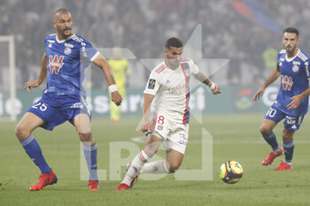 2021-09-12 - Houssem AOUAR of Lyon and Ludovic AJORQUE of Strasbourg during the French championship Ligue 1 football match between Olympique lyonnais and Racing Club de Strasbourg Alsace on September 12, 2021 at Groupama Stadium in Décines-Charpieu, near Lyon, France - OLYMPIQUE LYONNAIS VS RACING CLUB DE STRASBOURG ALSACE - FRENCH LIGUE 1 - SOCCER