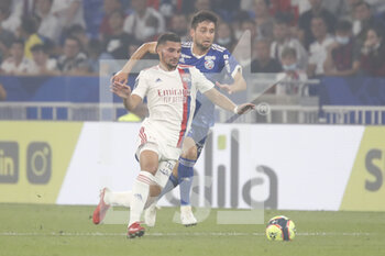 2021-09-12 - Houssem AOUAR of Lyon and Sanjin PRCIC of Strasbourg during the French championship Ligue 1 football match between Olympique lyonnais and Racing Club de Strasbourg Alsace on September 12, 2021 at Groupama Stadium in Décines-Charpieu, near Lyon, France - OLYMPIQUE LYONNAIS VS RACING CLUB DE STRASBOURG ALSACE - FRENCH LIGUE 1 - SOCCER