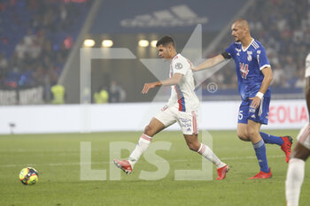 2021-09-12 - Bruno GUIMARAES of Lyon and Ludovic AJORQUE of Strasbourg during the French championship Ligue 1 football match between Olympique lyonnais and Racing Club de Strasbourg Alsace on September 12, 2021 at Groupama Stadium in Décines-Charpieu, near Lyon, France - OLYMPIQUE LYONNAIS VS RACING CLUB DE STRASBOURG ALSACE - FRENCH LIGUE 1 - SOCCER