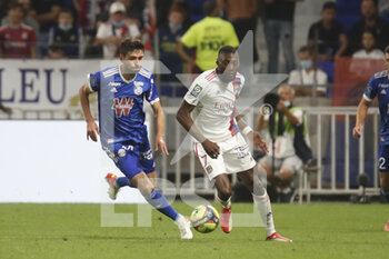 2021-09-12 - Karl TOKO EKAMBI of Lyon and Sanjin PRCIC of Strasbourg during the French championship Ligue 1 football match between Olympique lyonnais and Racing Club de Strasbourg Alsace on September 12, 2021 at Groupama Stadium in Décines-Charpieu, near Lyon, France - OLYMPIQUE LYONNAIS VS RACING CLUB DE STRASBOURG ALSACE - FRENCH LIGUE 1 - SOCCER