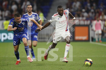 2021-09-12 - Karl TOKO EKAMBI of Lyon and Frederic GUILBERT of Strasbourg during the French championship Ligue 1 football match between Olympique lyonnais and Racing Club de Strasbourg Alsace on September 12, 2021 at Groupama Stadium in Décines-Charpieu, near Lyon, France - OLYMPIQUE LYONNAIS VS RACING CLUB DE STRASBOURG ALSACE - FRENCH LIGUE 1 - SOCCER