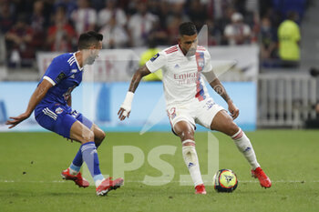 2021-09-12 - Emerson PALMIERI of Lyon and Adrien THOMASSON of Strasbourg during the French championship Ligue 1 football match between Olympique lyonnais and Racing Club de Strasbourg Alsace on September 12, 2021 at Groupama Stadium in Décines-Charpieu, near Lyon, France - OLYMPIQUE LYONNAIS VS RACING CLUB DE STRASBOURG ALSACE - FRENCH LIGUE 1 - SOCCER