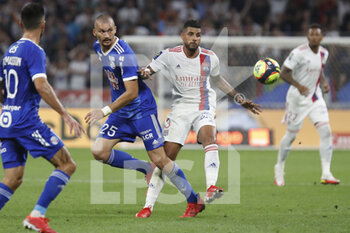 2021-09-12 - Emerson PALMIERI of Lyon and Ludovic AJORQUE of Strasbourg during the French championship Ligue 1 football match between Olympique lyonnais and Racing Club de Strasbourg Alsace on September 12, 2021 at Groupama Stadium in Décines-Charpieu, near Lyon, France - OLYMPIQUE LYONNAIS VS RACING CLUB DE STRASBOURG ALSACE - FRENCH LIGUE 1 - SOCCER