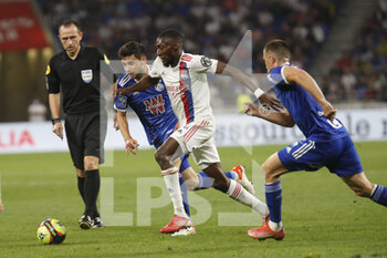 2021-09-12 - Karl TOKO EKAMBI of Lyon and Sanjin PRCIC of Strasbourg and Frederic GUILBERT of Strasbourg during the French championship Ligue 1 football match between Olympique lyonnais and Racing Club de Strasbourg Alsace on September 12, 2021 at Groupama Stadium in Décines-Charpieu, near Lyon, France - OLYMPIQUE LYONNAIS VS RACING CLUB DE STRASBOURG ALSACE - FRENCH LIGUE 1 - SOCCER