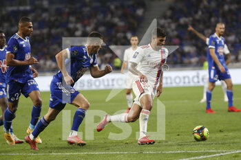 2021-09-12 - Bruno GUIMARAES of Lyon and Frederic GUILBERT of Strasbourg during the French championship Ligue 1 football match between Olympique lyonnais and Racing Club de Strasbourg Alsace on September 12, 2021 at Groupama Stadium in Décines-Charpieu, near Lyon, France - OLYMPIQUE LYONNAIS VS RACING CLUB DE STRASBOURG ALSACE - FRENCH LIGUE 1 - SOCCER