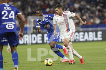 2021-09-12 - Bruno GUIMARAES of Lyon and Jean Eudes AHOLOU of Strasbourg during the French championship Ligue 1 football match between Olympique lyonnais and Racing Club de Strasbourg Alsace on September 12, 2021 at Groupama Stadium in Décines-Charpieu, near Lyon, France - OLYMPIQUE LYONNAIS VS RACING CLUB DE STRASBOURG ALSACE - FRENCH LIGUE 1 - SOCCER