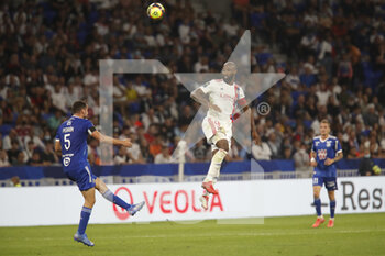 2021-09-12 - Moussa DEMBELE of Lyon and Lucas PERRIN of Strasbourg during the French championship Ligue 1 football match between Olympique lyonnais and Racing Club de Strasbourg Alsace on September 12, 2021 at Groupama Stadium in Décines-Charpieu, near Lyon, France - OLYMPIQUE LYONNAIS VS RACING CLUB DE STRASBOURG ALSACE - FRENCH LIGUE 1 - SOCCER