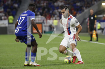 2021-09-12 - Rayan CHERKI of Lyon and Jean Ricner BELLEGARDE of Strasbourg during the French championship Ligue 1 football match between Olympique lyonnais and Racing Club de Strasbourg Alsace on September 12, 2021 at Groupama Stadium in Décines-Charpieu, near Lyon, France - OLYMPIQUE LYONNAIS VS RACING CLUB DE STRASBOURG ALSACE - FRENCH LIGUE 1 - SOCCER