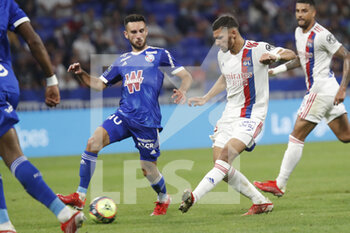 2021-09-12 - Houssem AOUAR of Lyon and Adrien THOMASSON of Strasbourg during the French championship Ligue 1 football match between Olympique lyonnais and Racing Club de Strasbourg Alsace on September 12, 2021 at Groupama Stadium in Décines-Charpieu, near Lyon, France - OLYMPIQUE LYONNAIS VS RACING CLUB DE STRASBOURG ALSACE - FRENCH LIGUE 1 - SOCCER
