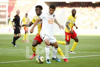 2021-09-18 - Benjamin Andre of Lille, Arnaud Kalimuendo of Lens (left) during the French championship Ligue 1 football match between RC Lens (RCL) and Lille OSC (LOSC) on September 18, 2021 at stade Felix Bollaert-Delelis in Lens, France - RC LENS (RCL) VS LILLE OSC (LOSC) - FRENCH LIGUE 1 - SOCCER