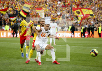 2021-09-18 - Burak Yilmaz of Lille, Jonathan Gradit of Lens during the French championship Ligue 1 football match between RC Lens (RCL) and Lille OSC (LOSC) on September 18, 2021 at stade Felix Bollaert-Delelis in Lens, France - RC LENS (RCL) VS LILLE OSC (LOSC) - FRENCH LIGUE 1 - SOCCER