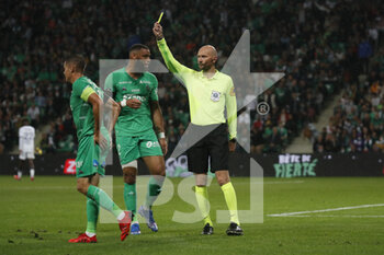 2021-09-18 - Referee Antony GAUTIER and Romain HAMOUMA of Saint Etienne yellow card and Harold MOUKOUDI of Saint Etienne during the French championship Ligue 1 football match between AS Saint-Etienne and FC Girondins de Bordeaux on September 18, 2021 at Geoffroy-Guichard stadium in Saint-Etienne, France - AS SAINT-ETIENNE VS FC GIRONDINS DE BORDEAUX - FRENCH LIGUE 1 - SOCCER