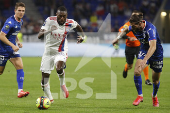 2021-09-25 - Karl TOKO EKAMBI of Lyon and Leo PETROT of Lorient during the French championship Ligue 1 football match between Olympique Lyonnais and FC Lorient on September 25, 2021 at Groupama stadium in Decines-Charpieu near Lyon, France - OLYMPIQUE LYONNAIS VS FC LORIENT - FRENCH LIGUE 1 - SOCCER