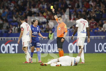 2021-09-25 - Referee Bastien DECHEPY and Laurent ABERGEL of Lorient yellow card during the French championship Ligue 1 football match between Olympique Lyonnais and FC Lorient on September 25, 2021 at Groupama stadium in Decines-Charpieu near Lyon, France - OLYMPIQUE LYONNAIS VS FC LORIENT - FRENCH LIGUE 1 - SOCCER